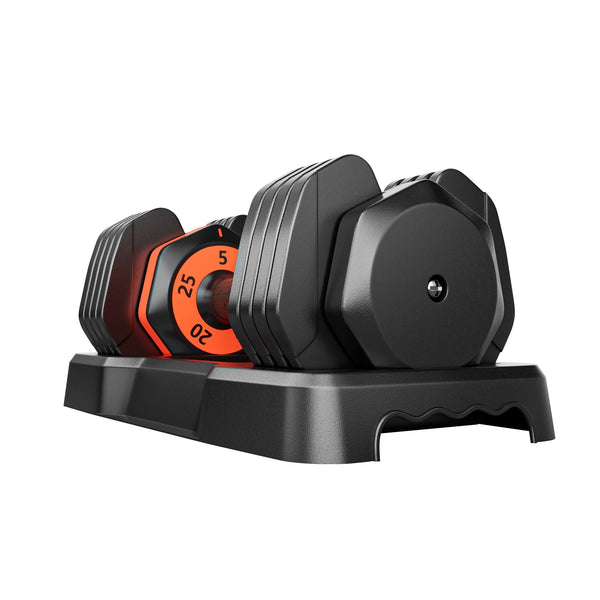 Set of adjustable dumbbells on a black stand with visible weight markings.