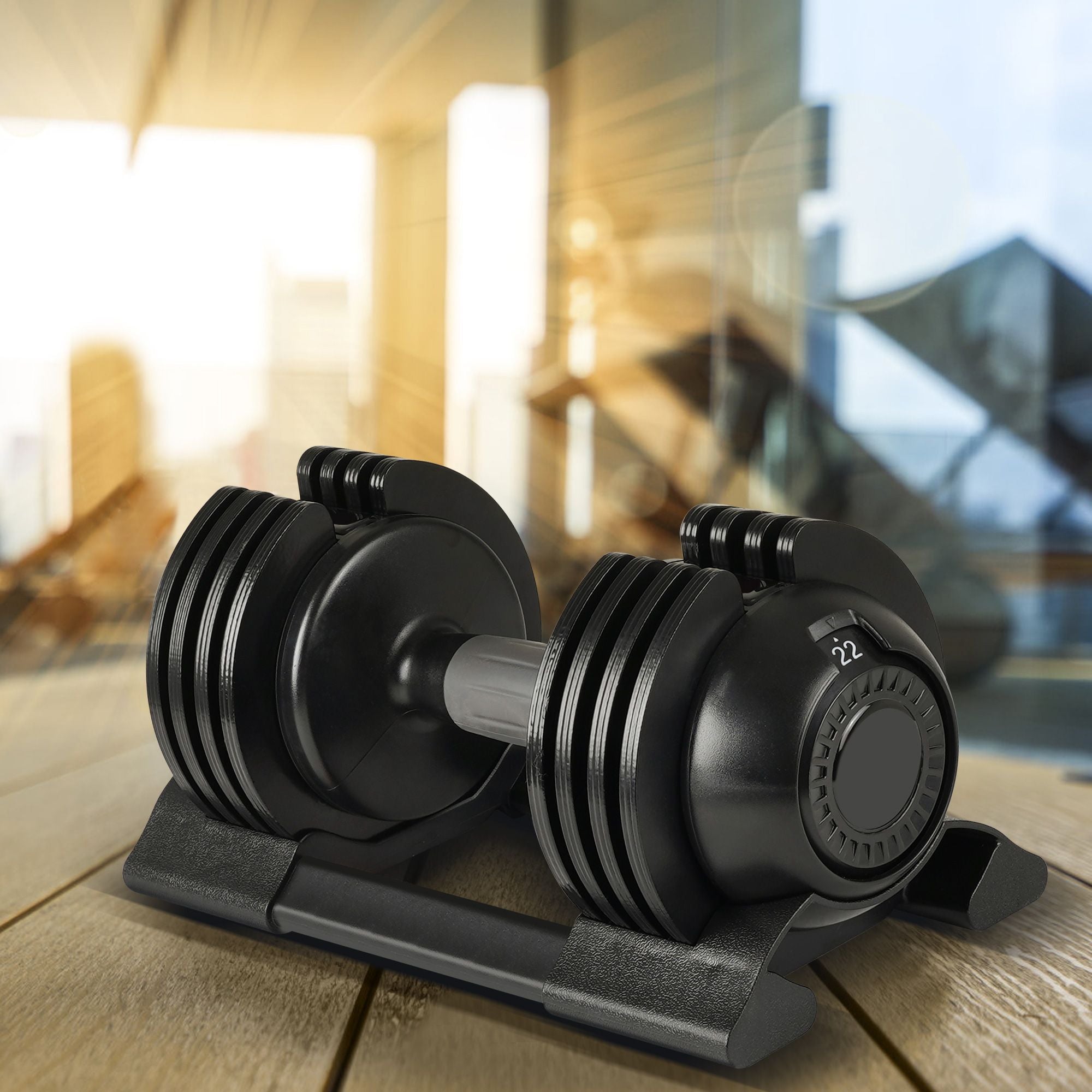 Pair of adjustable dumbbells in black color.