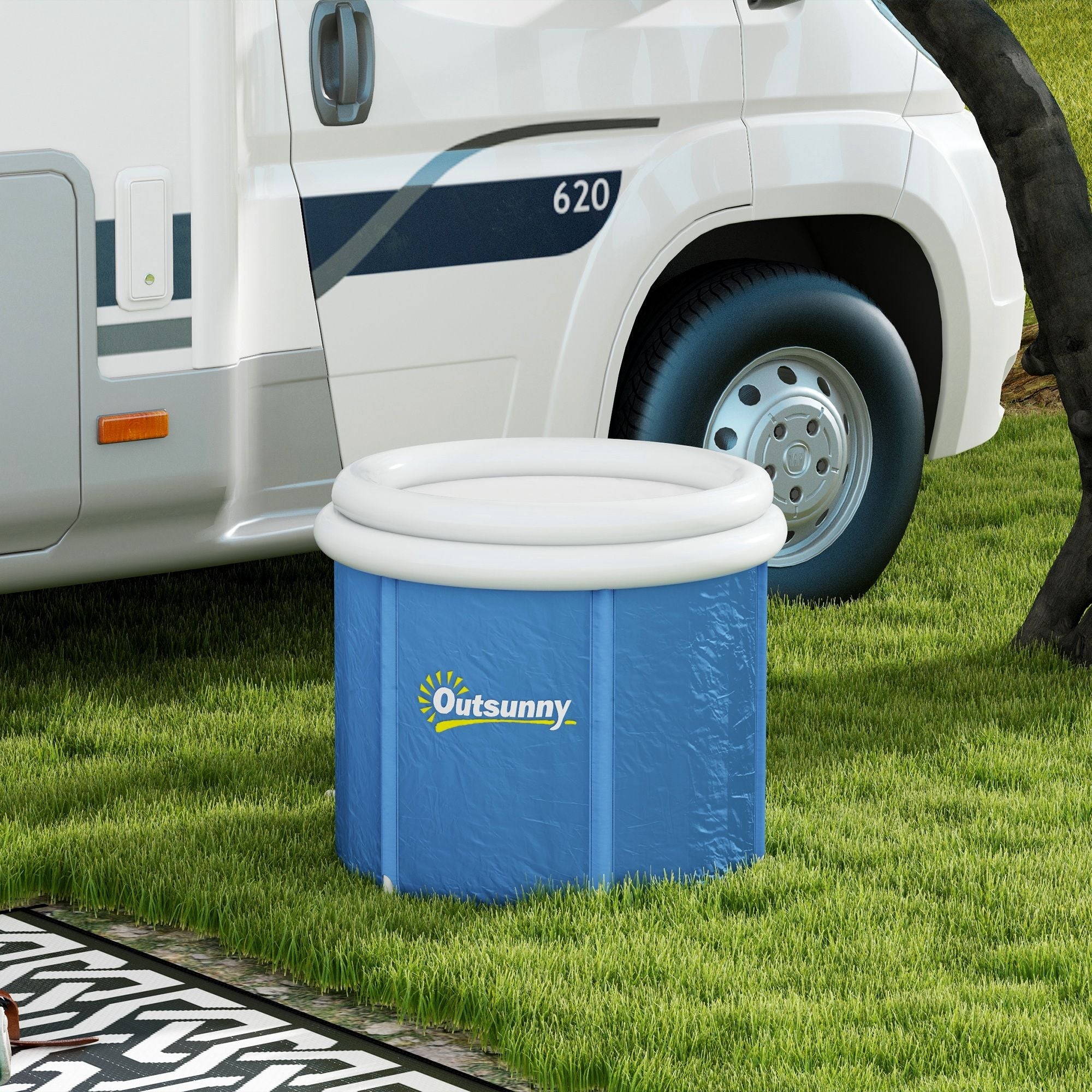 Blue inflatable bucket with white lid next to a white RV on grass