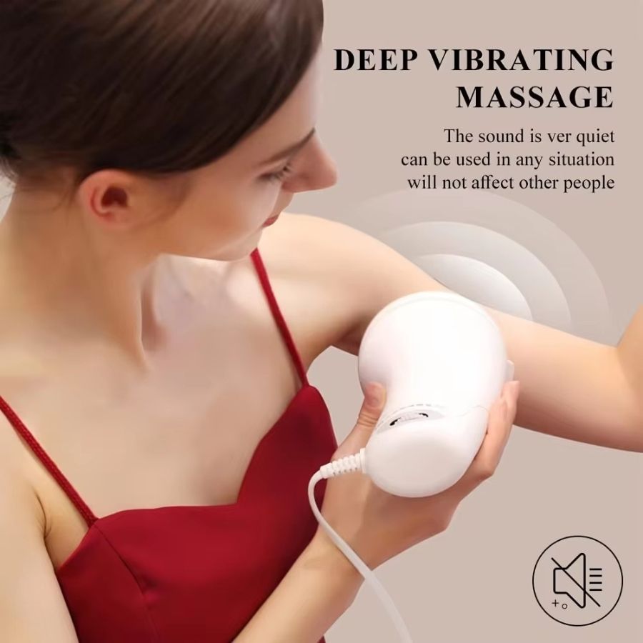 Woman holding a white deep vibrating massage device.