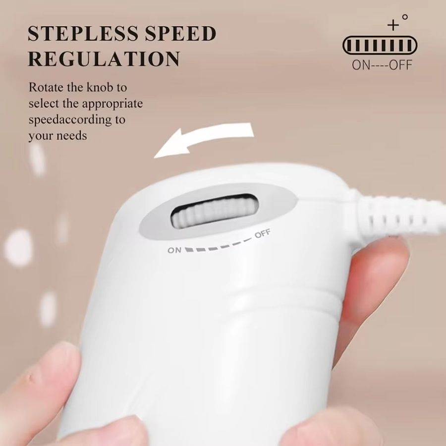 White handheld device with stepless speed regulation knob held by a hand on a beige background
